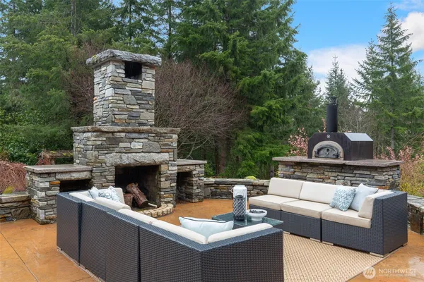 a view of a house with a yard and sitting area