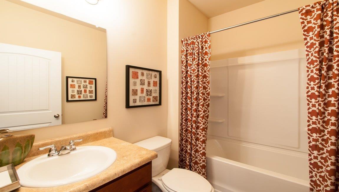 981 Indian Woman Road Santa Rosa Beach, FL 32459 - Photo 28 of 30 a bathroom with a sink toilet and shower