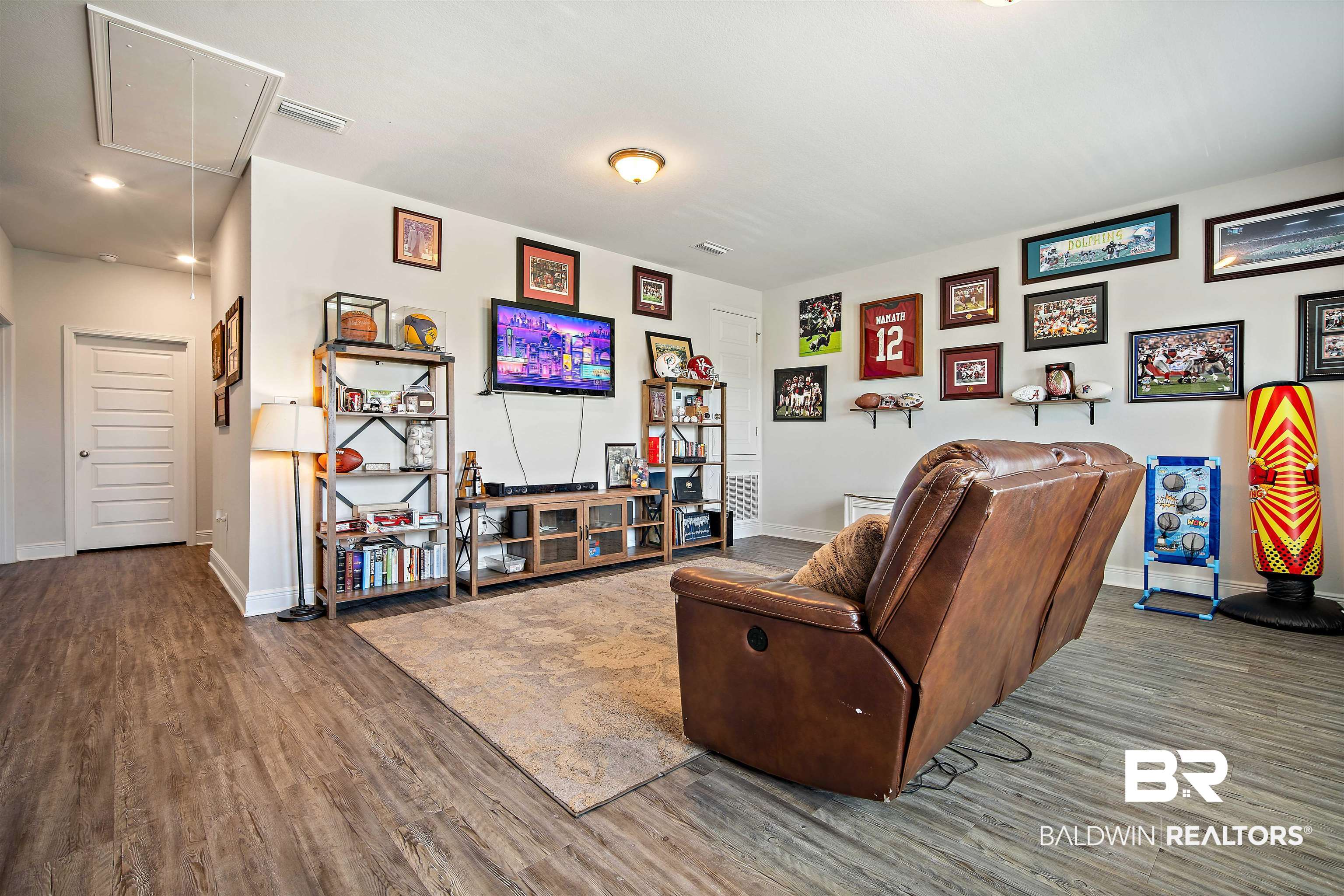 24341 Alydar Loop Daphne, AL 36526 - Photo 22 of 45 Living area featuring attic access and wood finished floors