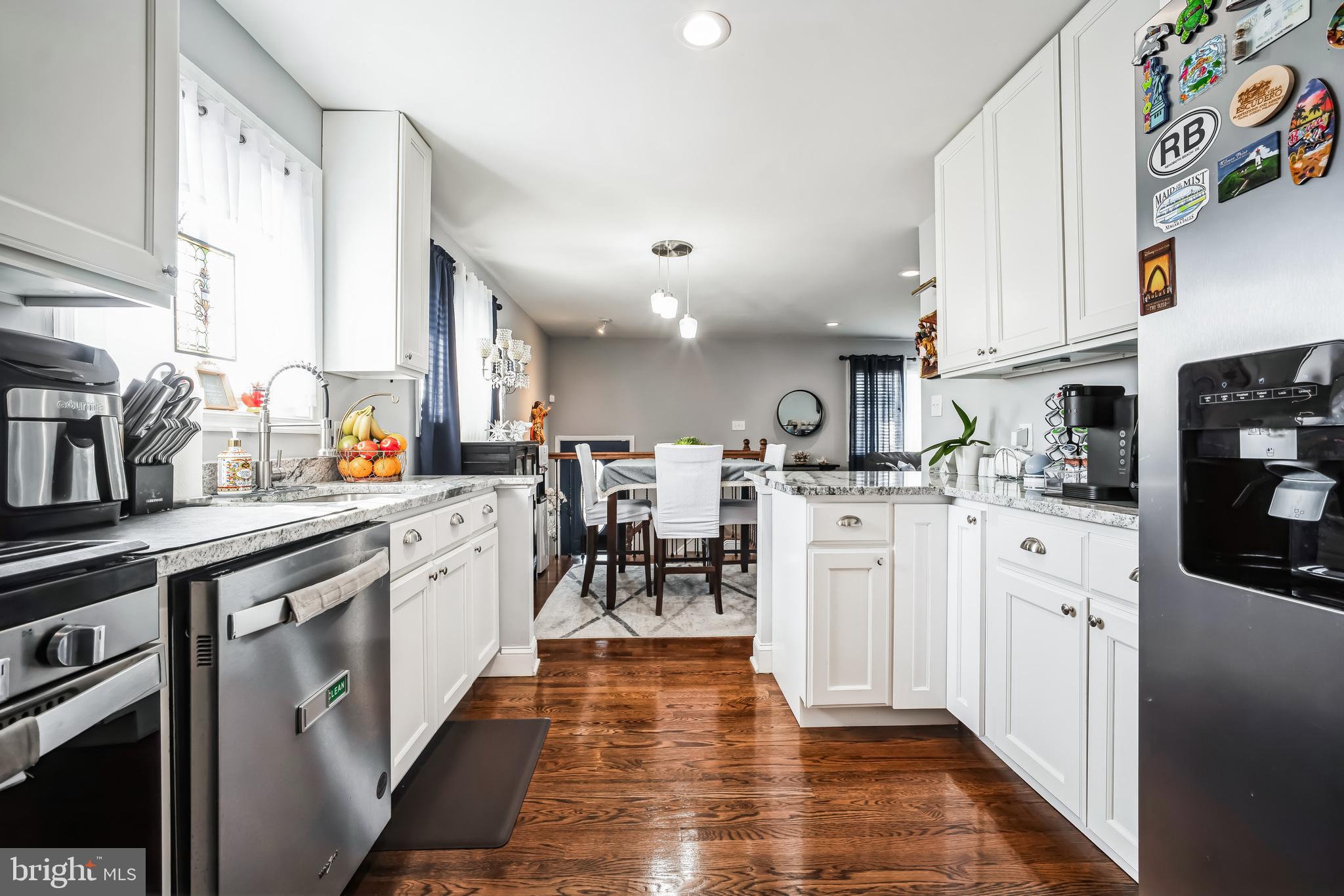 7113 Evanston Road Springfield, VA 22150 - Photo 13 of 30 a kitchen with white cabinets appliances and a window