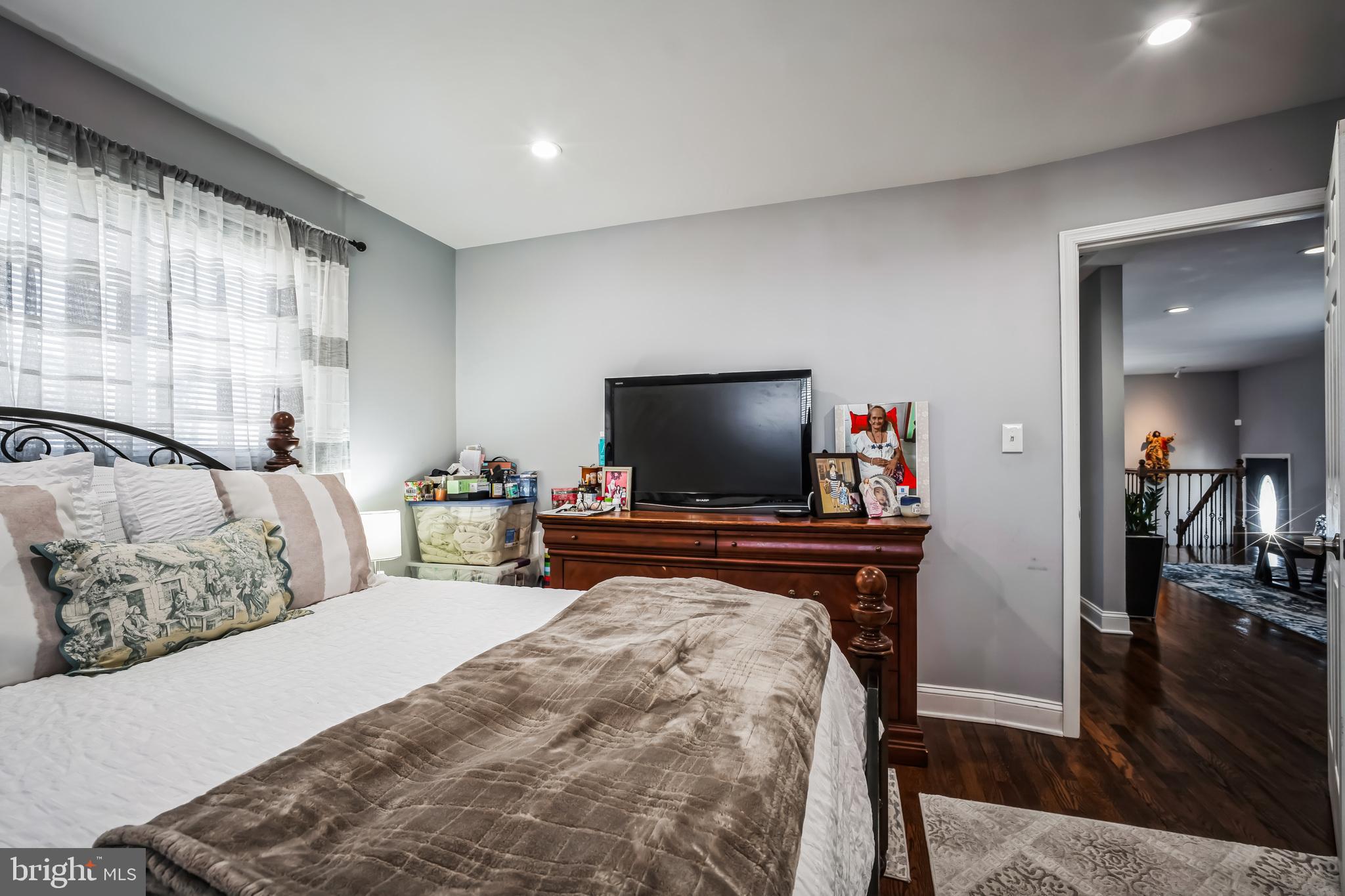 7113 Evanston Road Springfield, VA 22150 - Photo 20 of 30 a bedroom with a bed and a flat screen tv