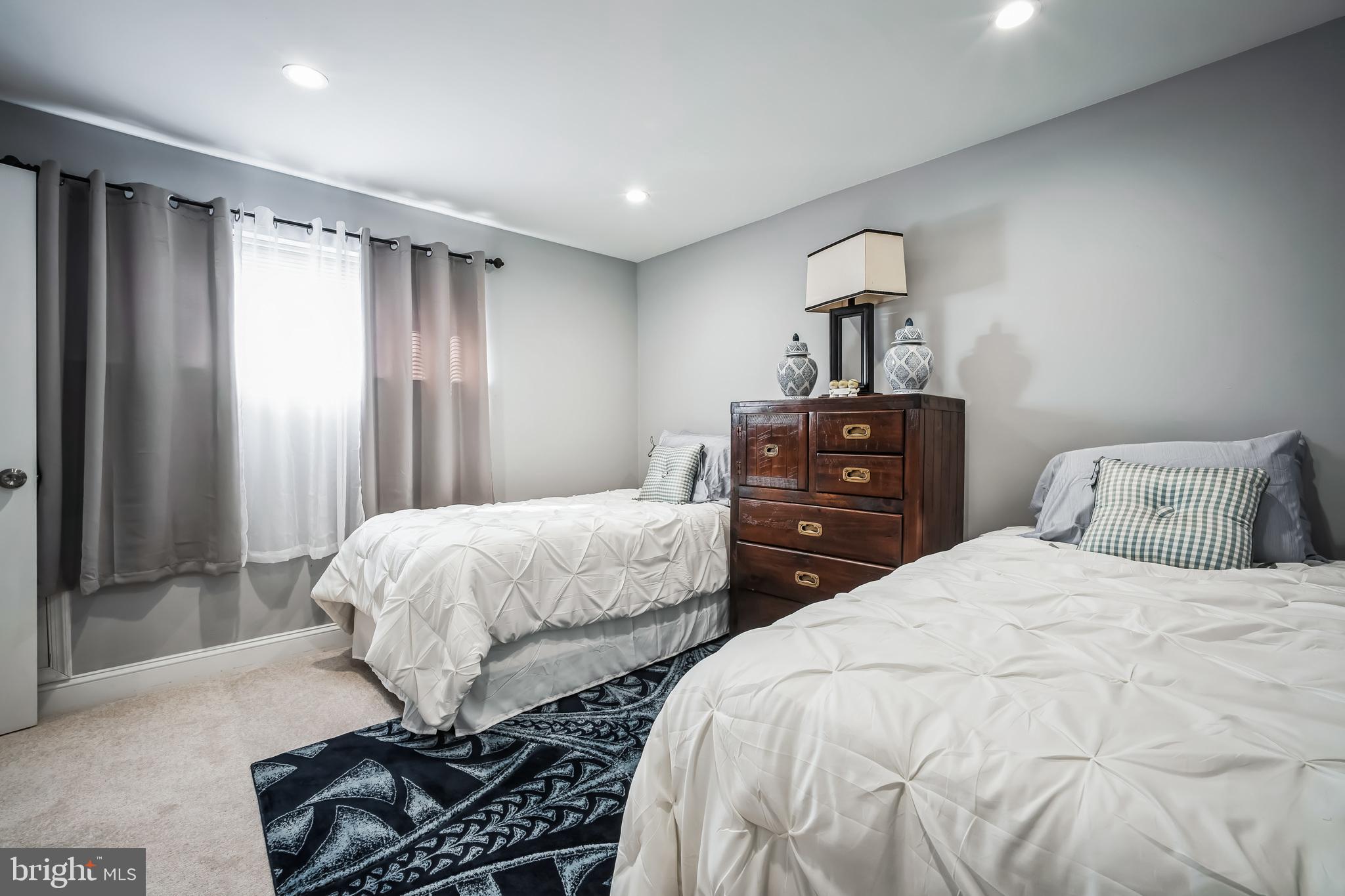 7113 Evanston Road Springfield, VA 22150 - Photo 25 of 30 a bedroom with two beds and a window