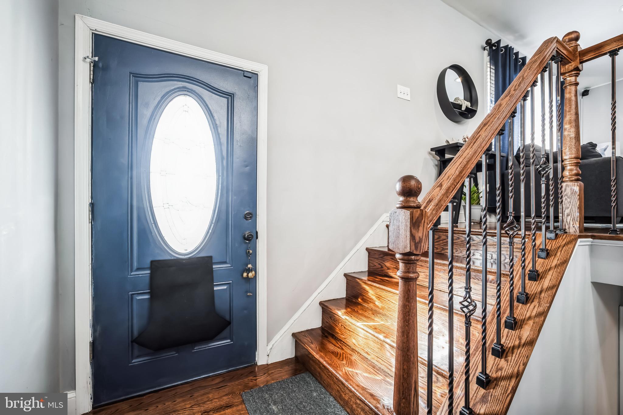 7113 Evanston Road Springfield, VA 22150 - Photo 3 of 30 a view of staircase with wooden floor and windows