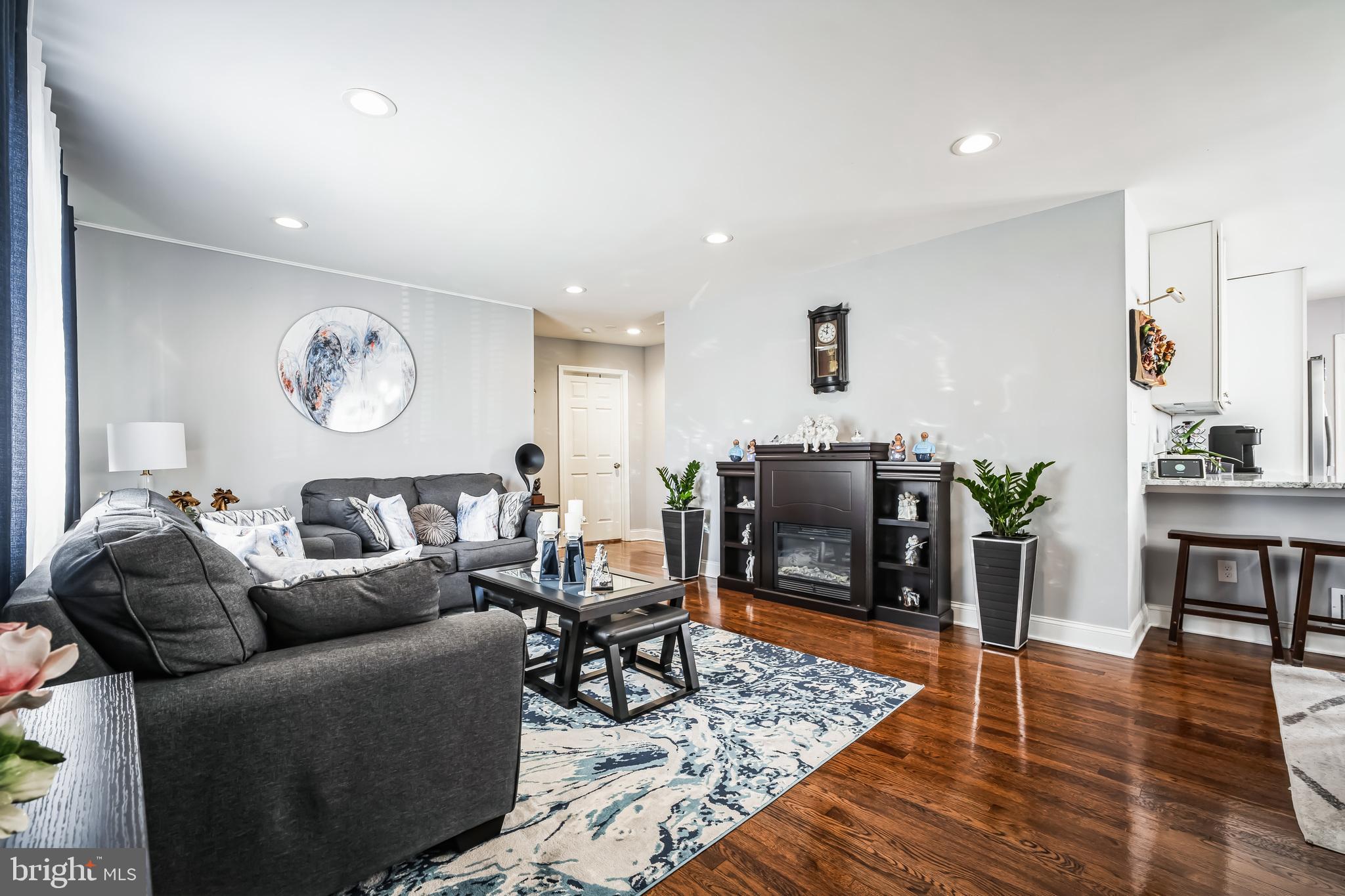 7113 Evanston Road Springfield, VA 22150 - Photo 5 of 30 a living room with furniture and wooden floor