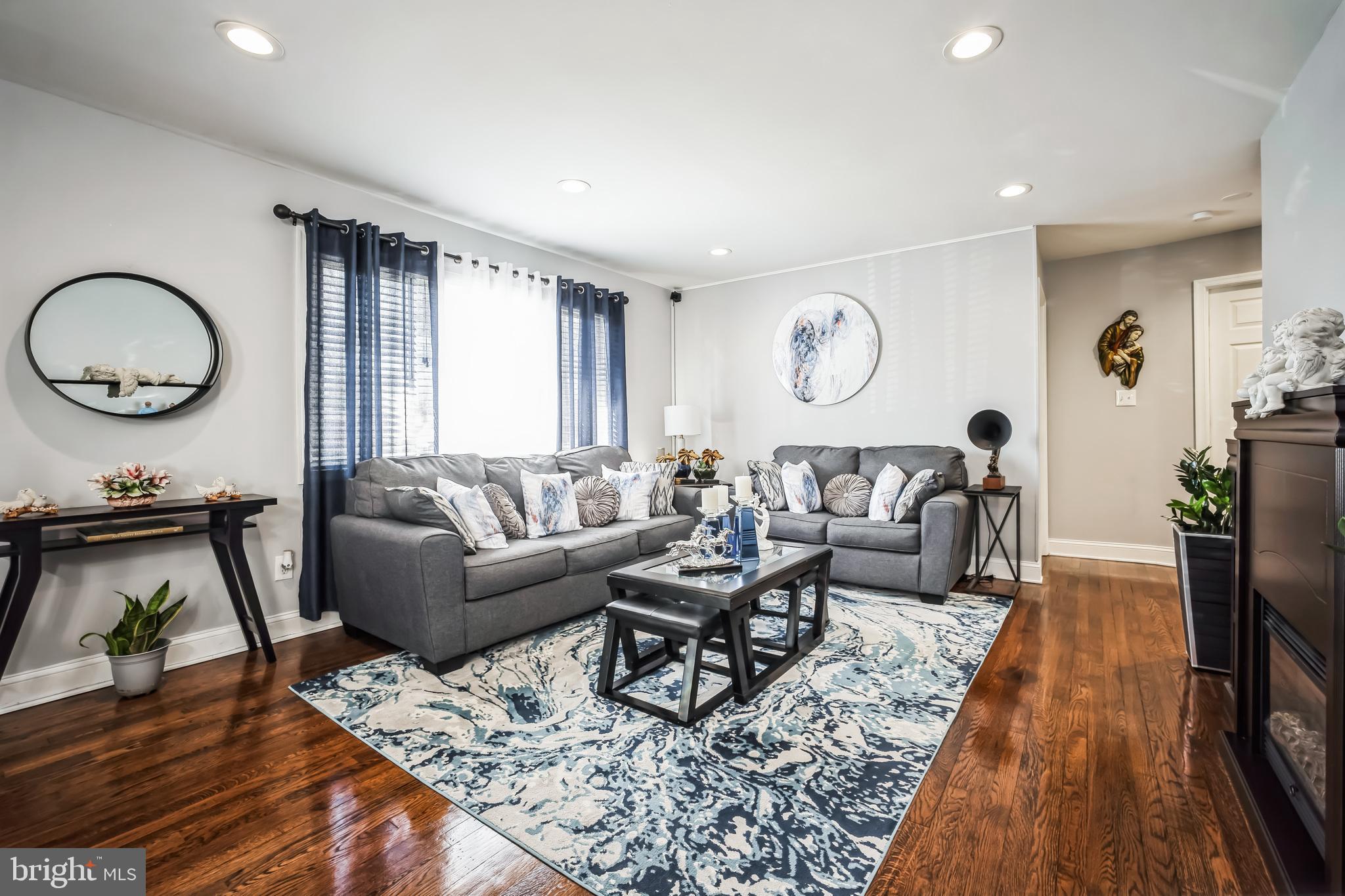 7113 Evanston Road Springfield, VA 22150 - Photo 8 of 30 a living room with furniture and wooden floor