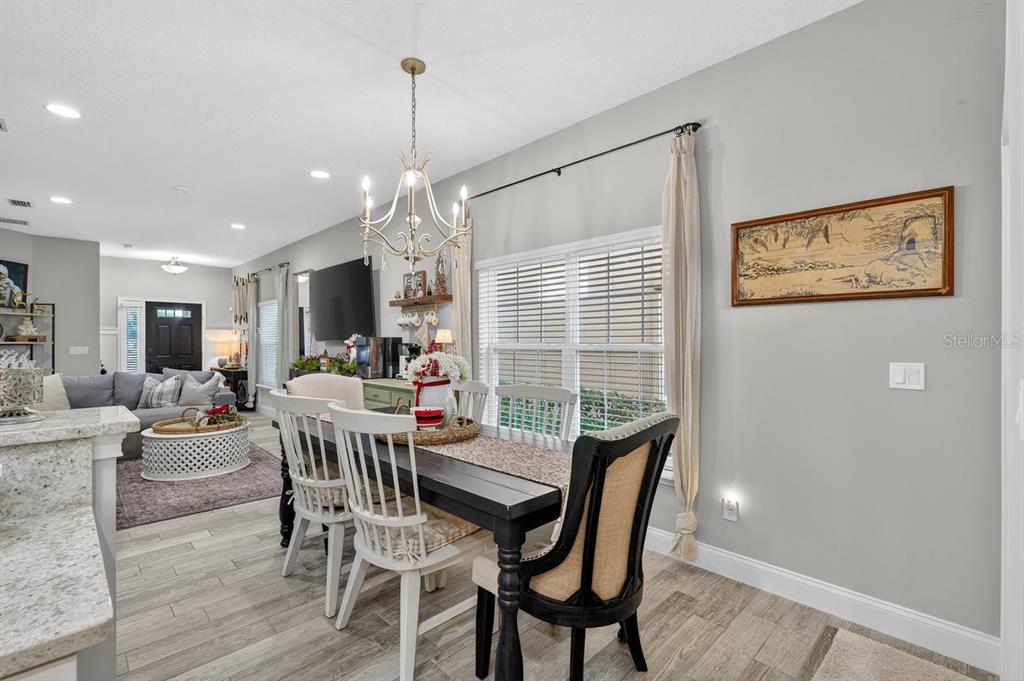 3417 Gallia Street New Smyrna Beach, FL 32168 - Photo 14 of 52 a dining room with furniture and window