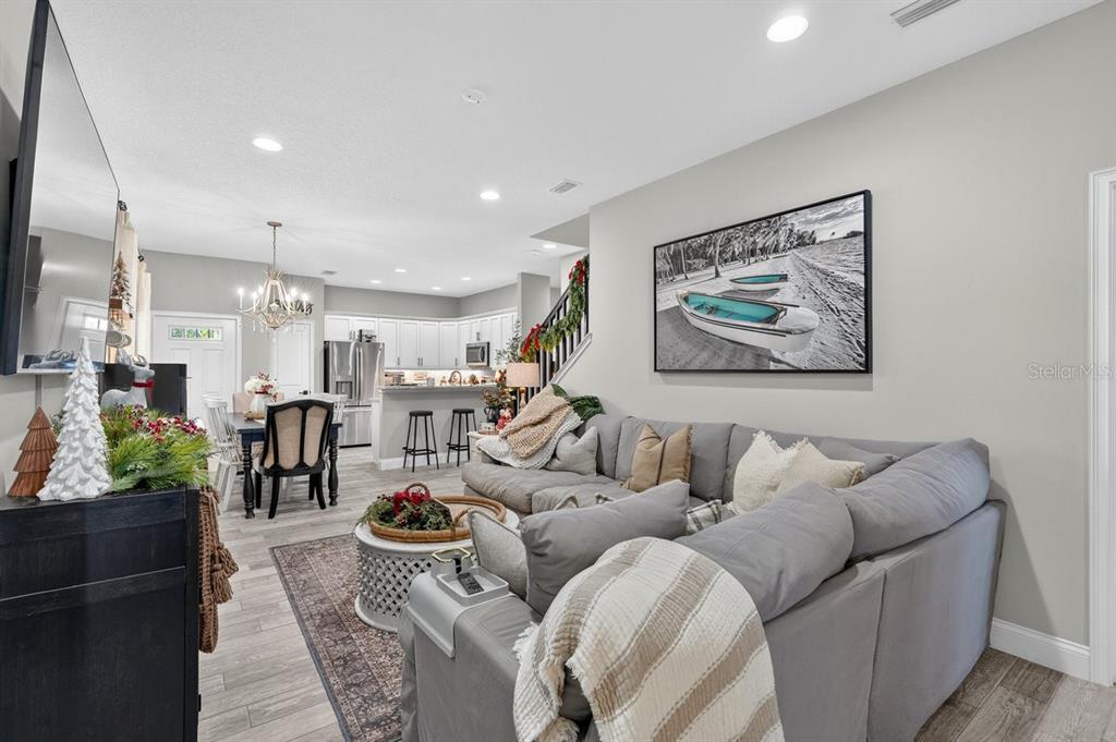 3417 Gallia Street New Smyrna Beach, FL 32168 - Photo 16 of 52 a living room with furniture potted plant and a large window