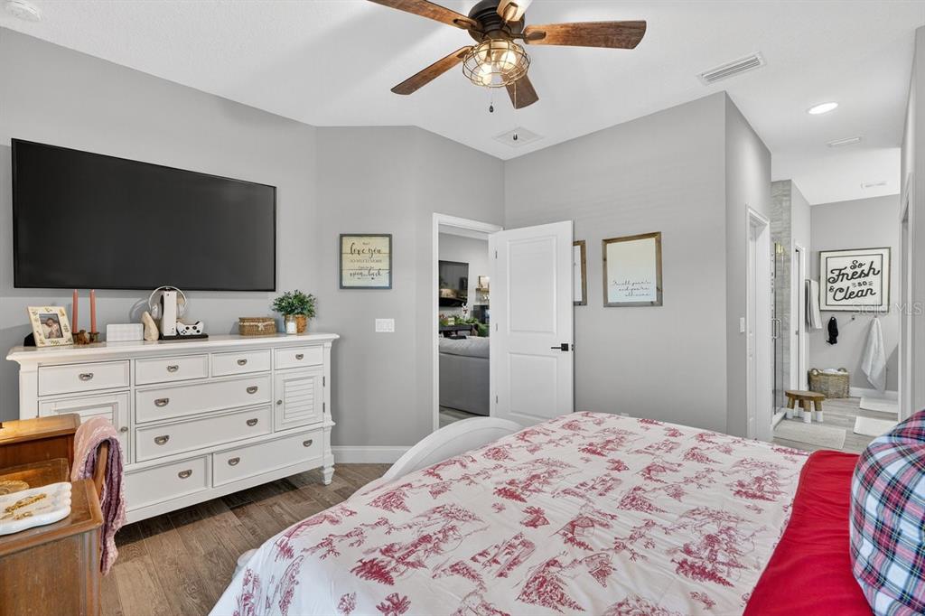 3417 Gallia Street New Smyrna Beach, FL 32168 - Photo 21 of 52 a bedroom with a bed and a flat screen tv