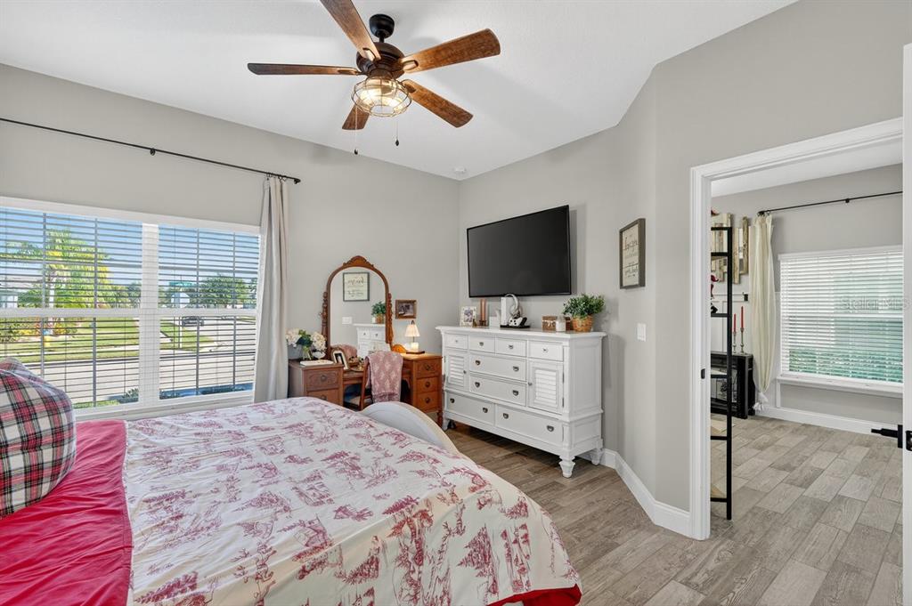 3417 Gallia Street New Smyrna Beach, FL 32168 - Photo 22 of 52 a bedroom with a bed and a flat screen tv