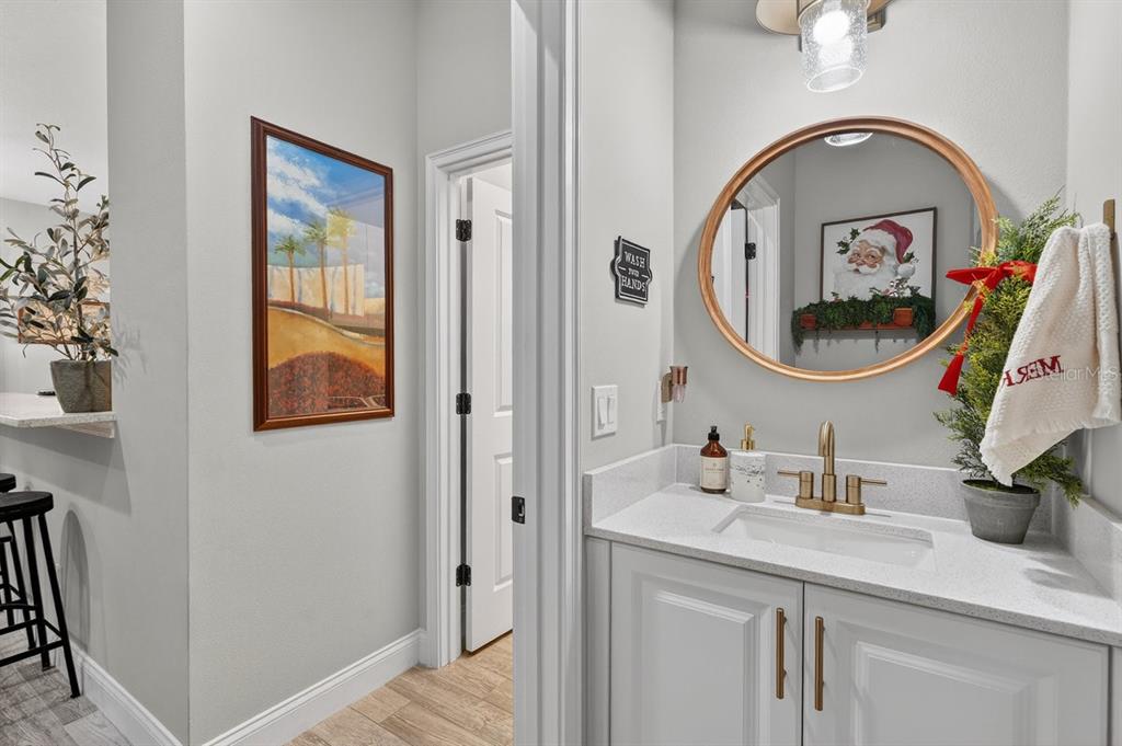 3417 Gallia Street New Smyrna Beach, FL 32168 - Photo 27 of 52 a bathroom with a sink and a mirror