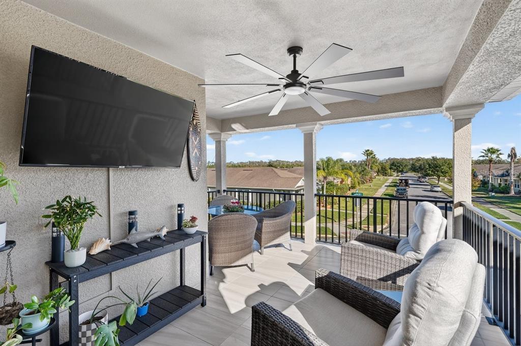 3417 Gallia Street New Smyrna Beach, FL 32168 - Photo 32 of 52 a living room with furniture tv and a large window