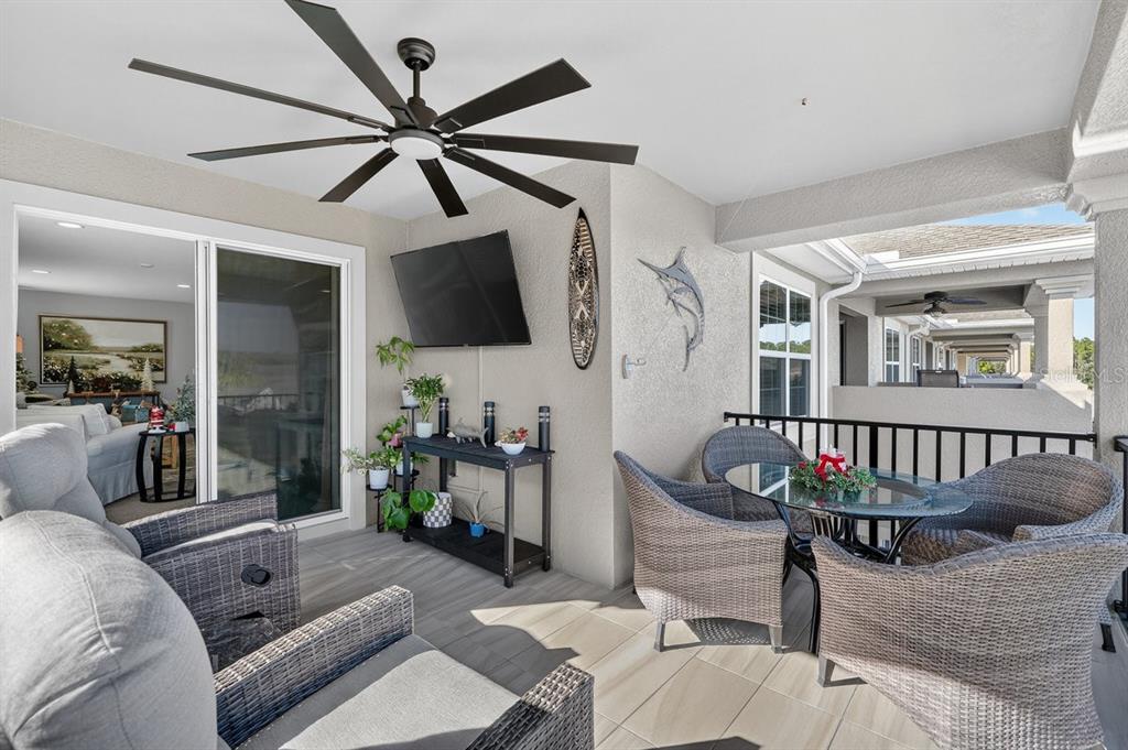 3417 Gallia Street New Smyrna Beach, FL 32168 - Photo 33 of 52 a living room with furniture a flat screen tv and a window