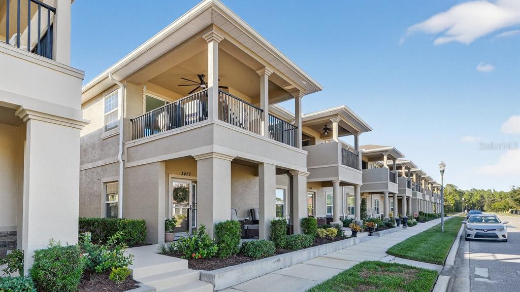 3417 Gallia Street New Smyrna Beach, FL 32168 - Photo 4 of 52 a front view of a house with garden