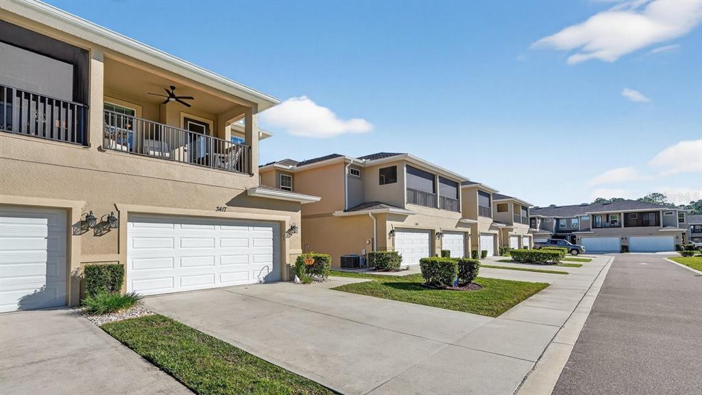 3417 Gallia Street New Smyrna Beach, FL 32168 - Photo 6 of 52 a front view of a house with a yard and garage