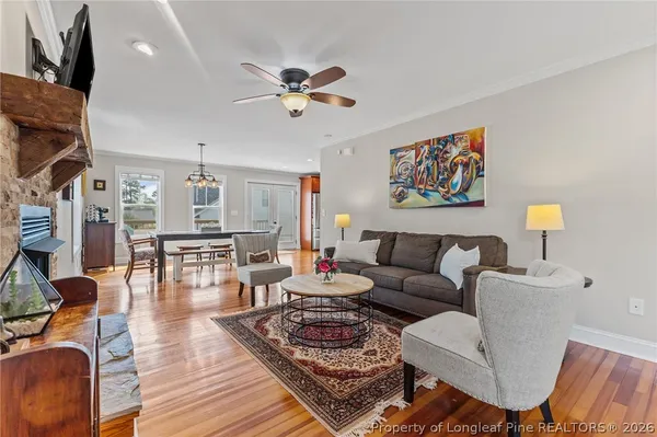 a kitchen with granite countertop stainless steel appliances a stove sink and microwave