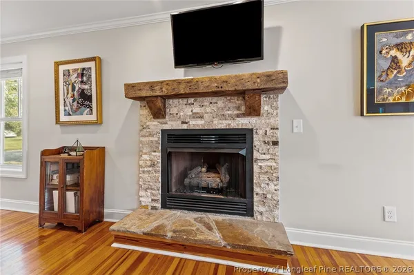 a bedroom with a bed and a ceiling fan
