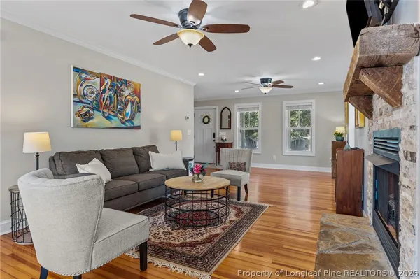 a bedroom with a bed and a wooden floor