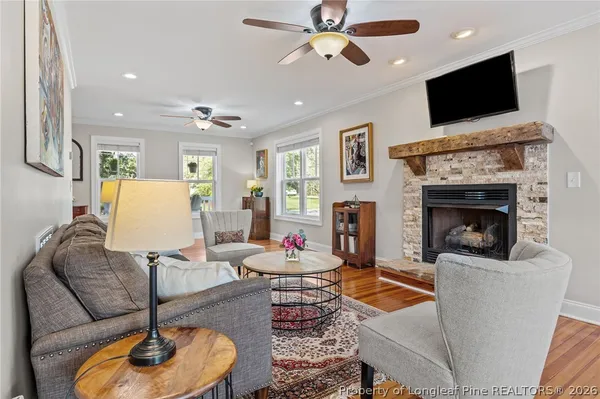 a view of staircase with wooden floor and window