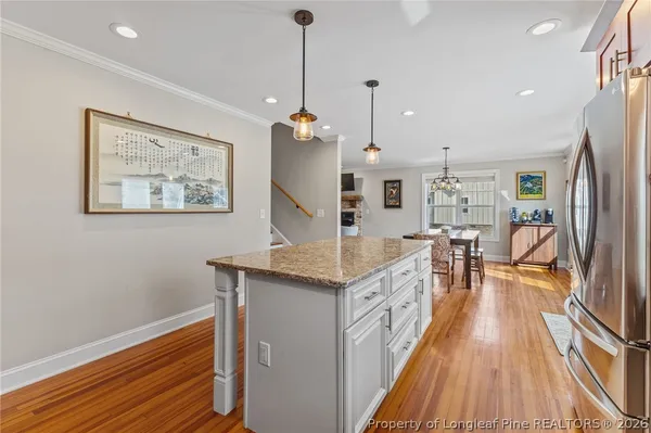 a front view of a house with a yard table and chairs