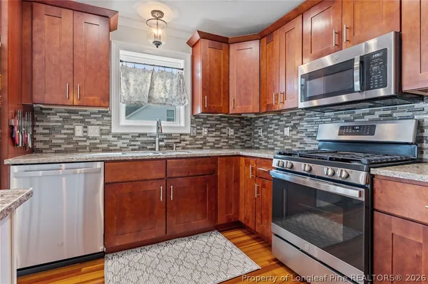 a view of a house with backyard porch and sitting area