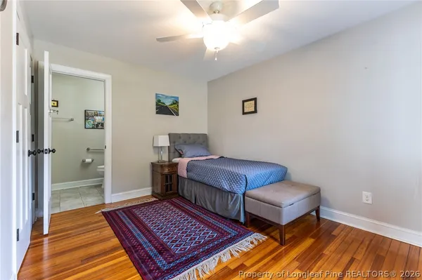a living room with a fireplace and a flat screen tv