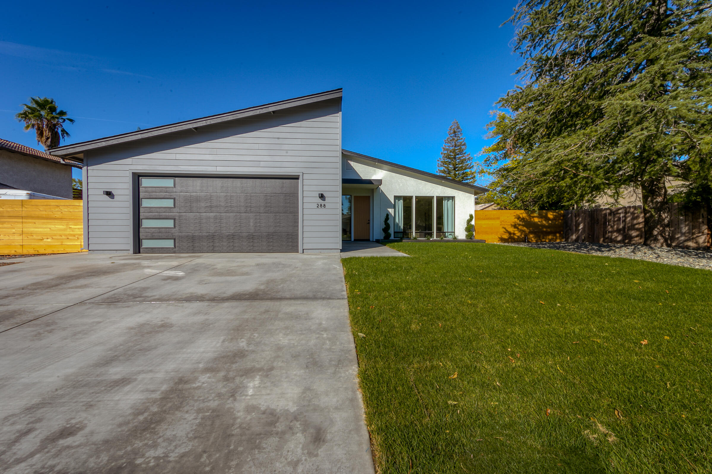 288 Tourmaline Way Redding, CA 96003 - Photo 1 of 46 a view of a house with a yard and garage