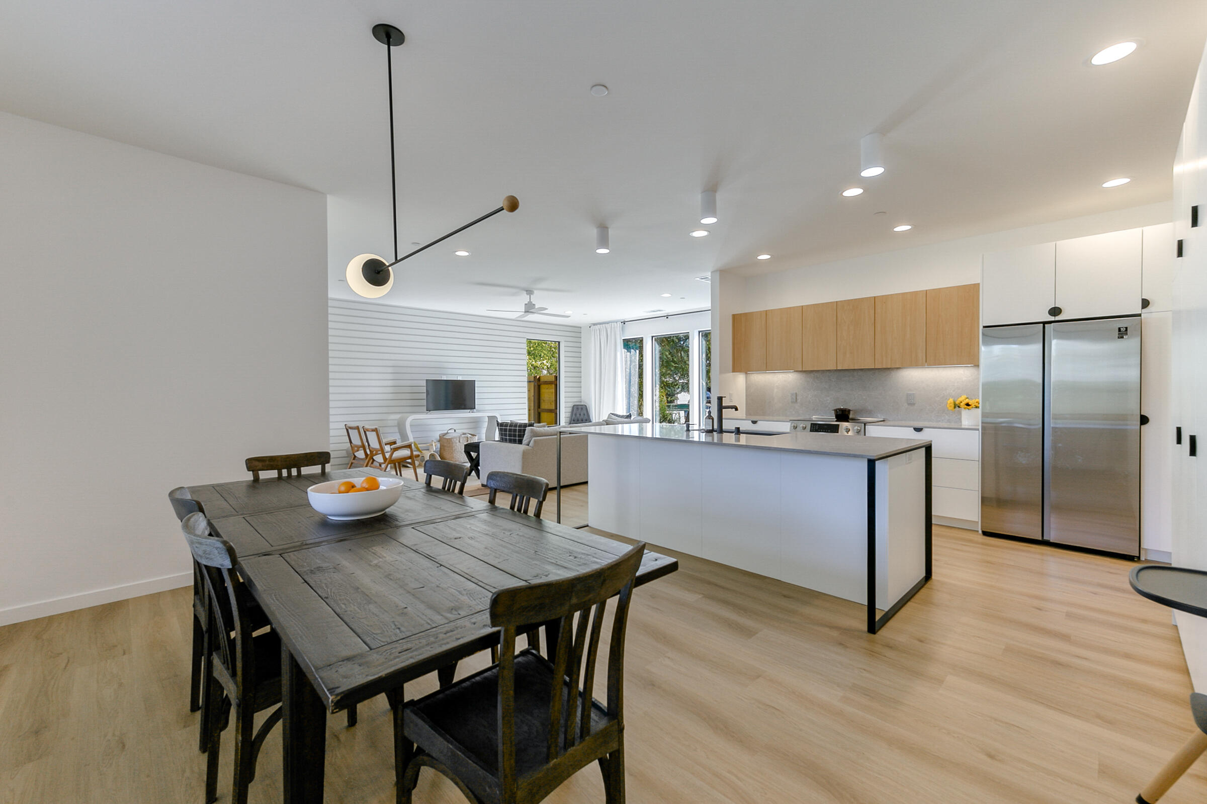 288 Tourmaline Way Redding, CA 96003 - Photo 11 of 46 a kitchen with stainless steel appliances granite countertop a kitchen island a stove a table and chairs in it