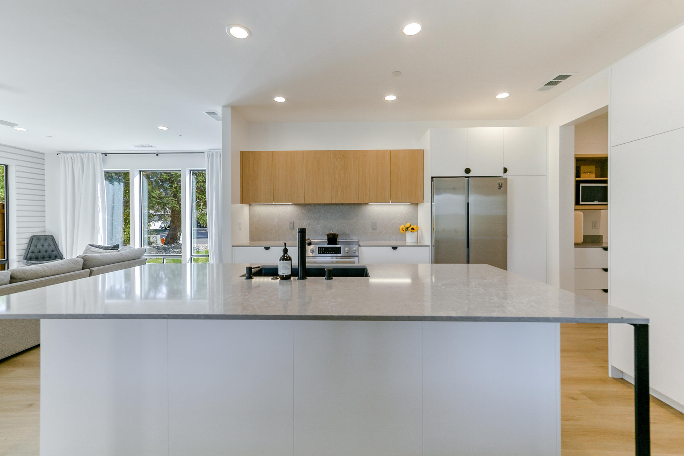 288 Tourmaline Way Redding, CA 96003 - Photo 12 of 46 a large kitchen with kitchen island a large counter top stainless steel appliances and a counter top space