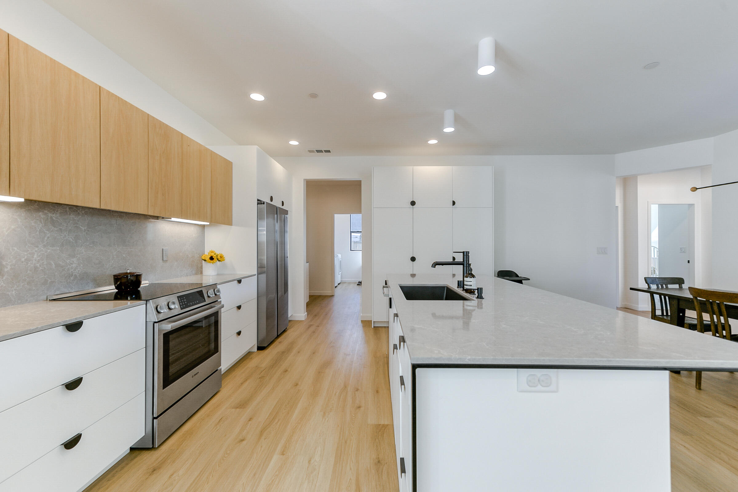 288 Tourmaline Way Redding, CA 96003 - Photo 14 of 46 a kitchen with a sink a counter top space stainless steel appliances and cabinets