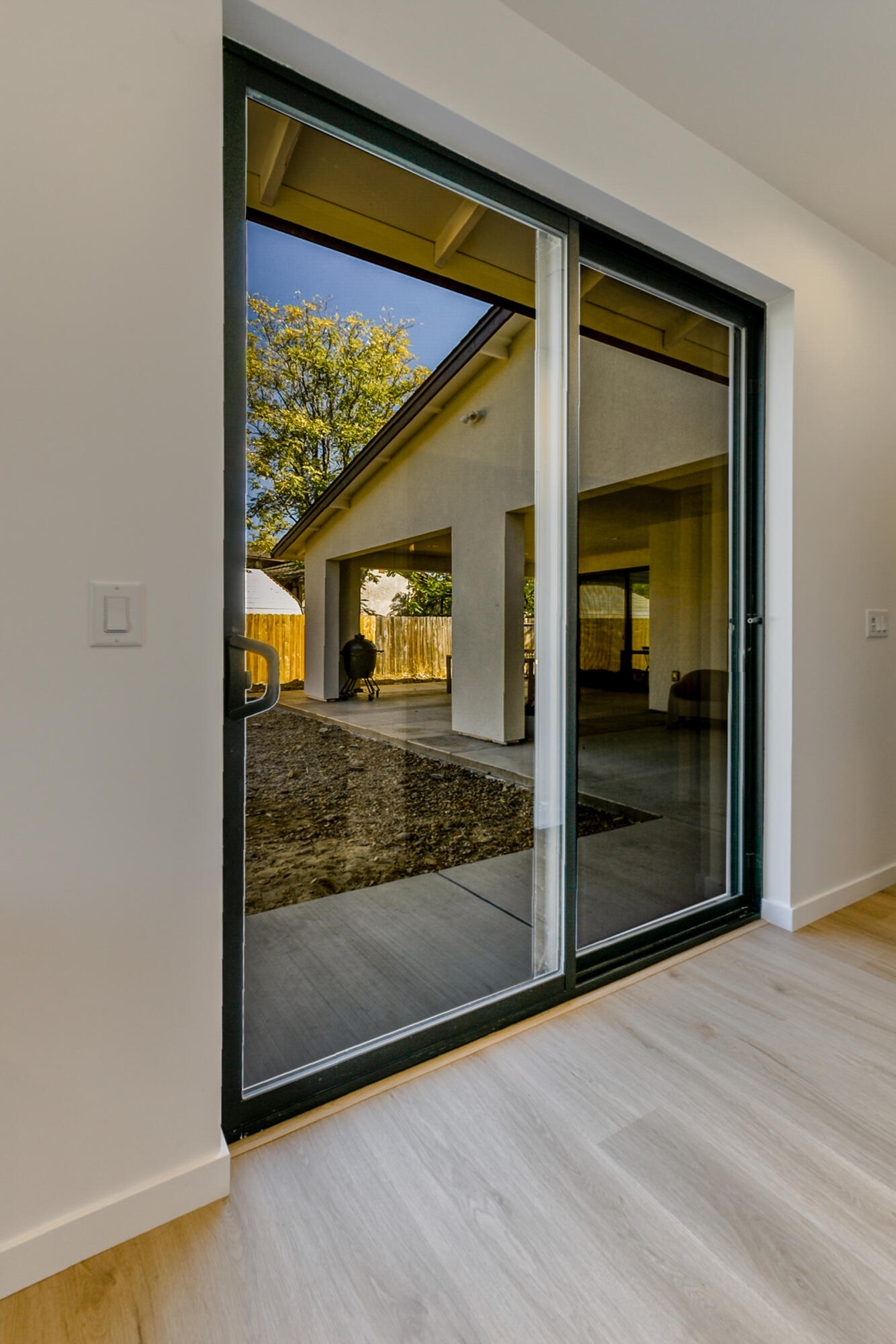 288 Tourmaline Way Redding, CA 96003 - Photo 21 of 46 a view of a glass door with a flat screen tv