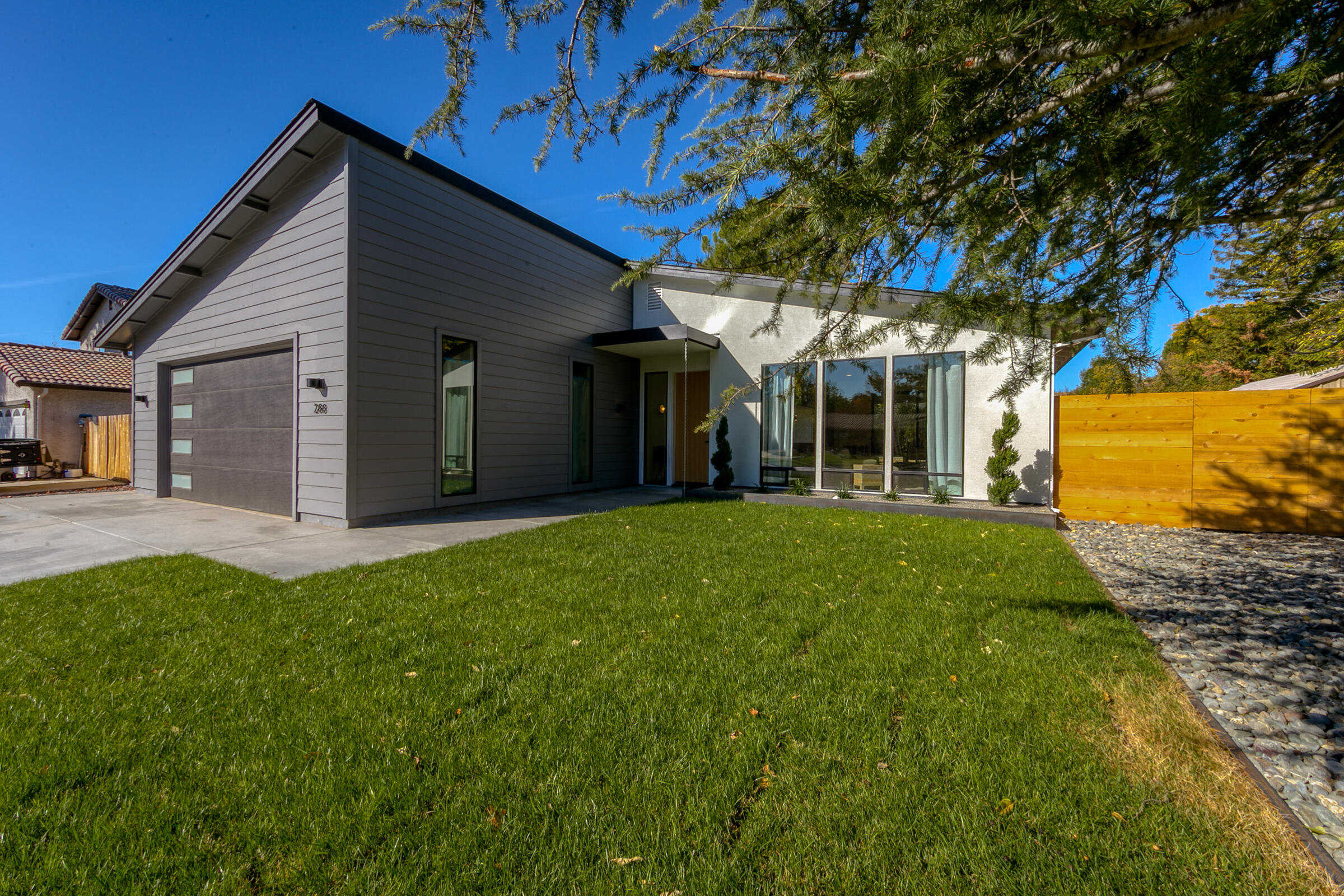 288 Tourmaline Way Redding, CA 96003 - Photo 3 of 46 a view of a house with backyard and garden