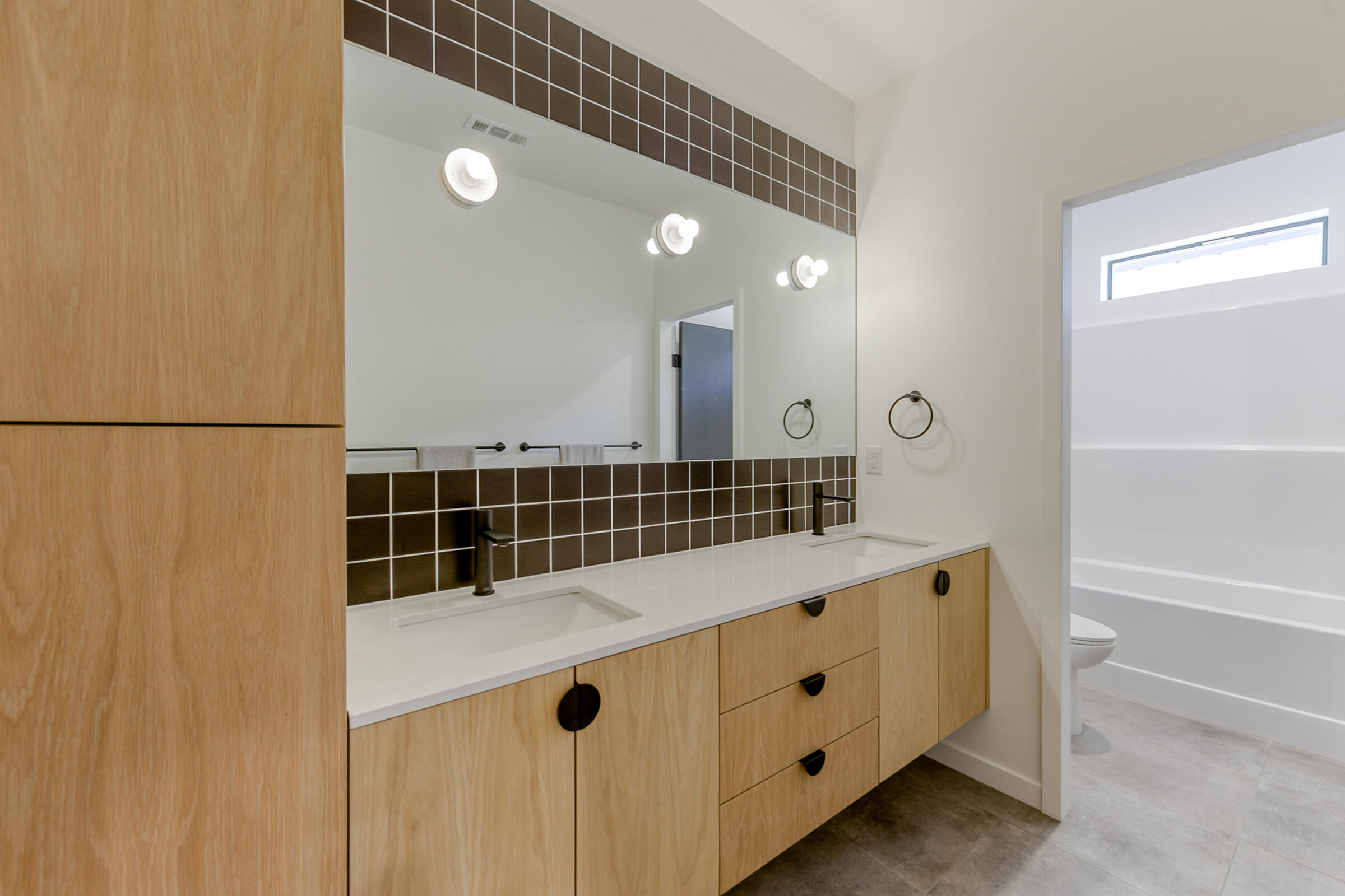 288 Tourmaline Way Redding, CA 96003 - Photo 31 of 46 a bathroom with a double vanity sink and a mirror