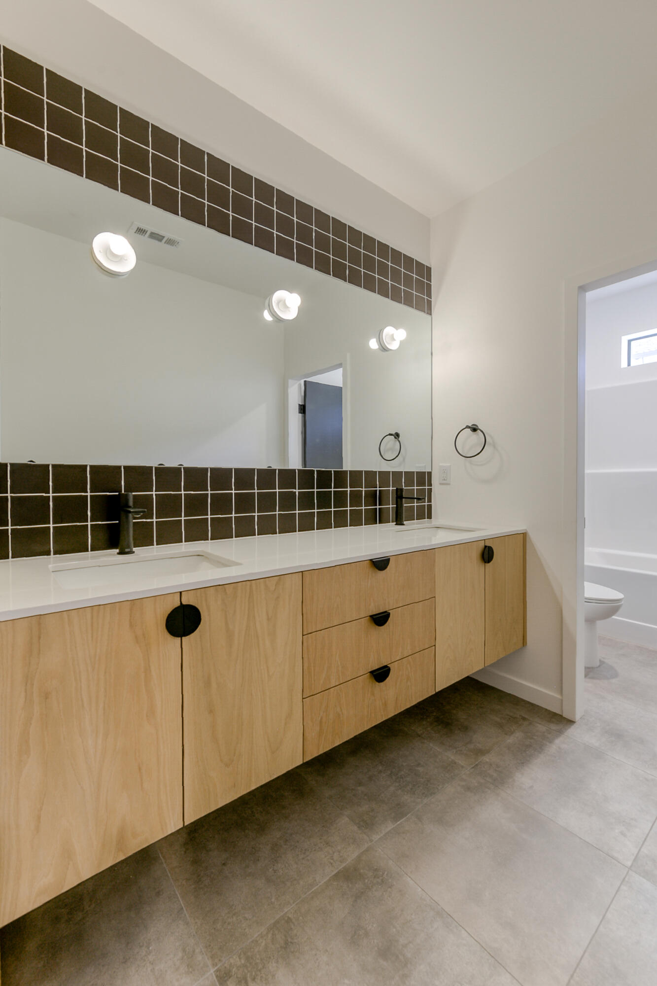 288 Tourmaline Way Redding, CA 96003 - Photo 32 of 46 a bathroom with a double vanity sink and a mirror