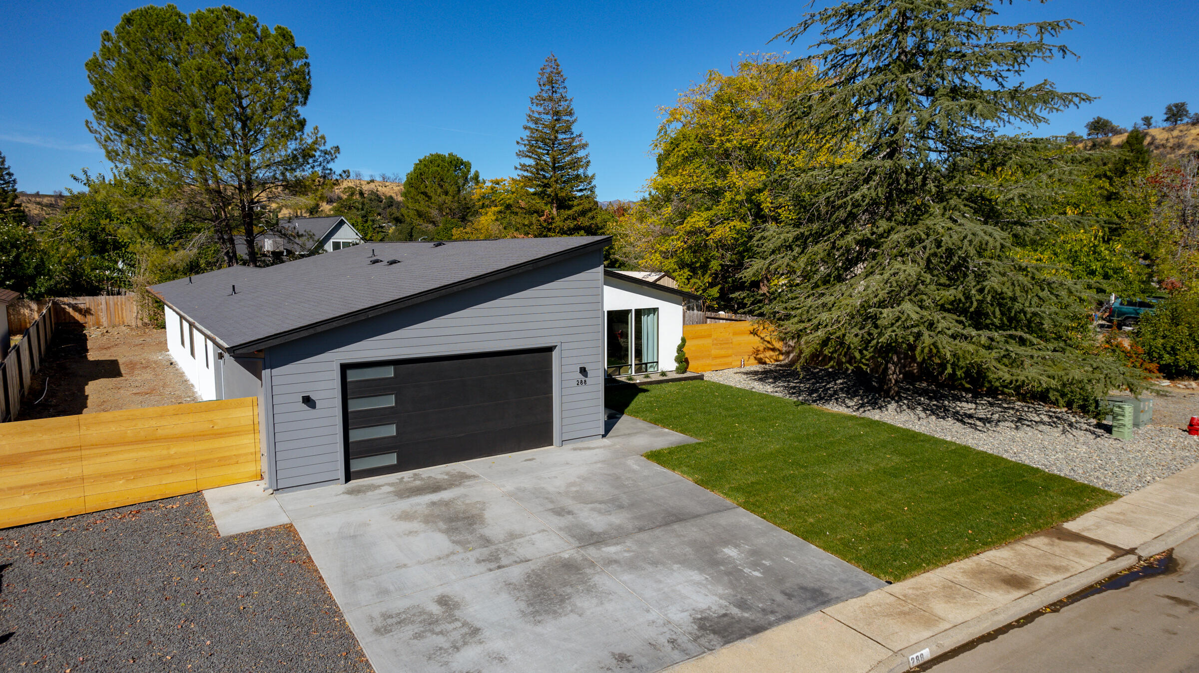 288 Tourmaline Way Redding, CA 96003 - Photo 42 of 46 a front view of a house with a yard and garage