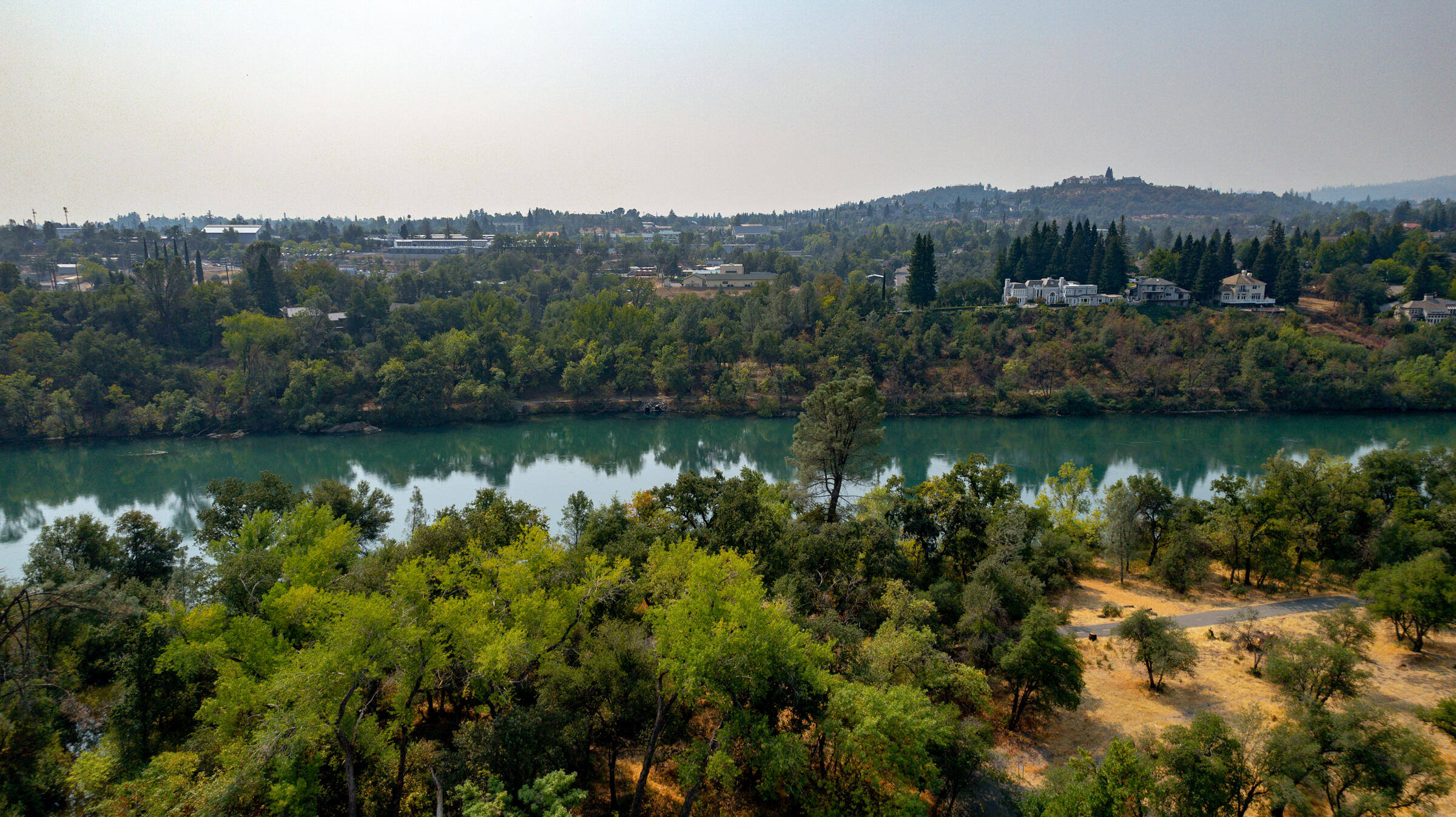 288 Tourmaline Way Redding, CA 96003 - Photo 45 of 46 a view of a lake with a mountain in the background