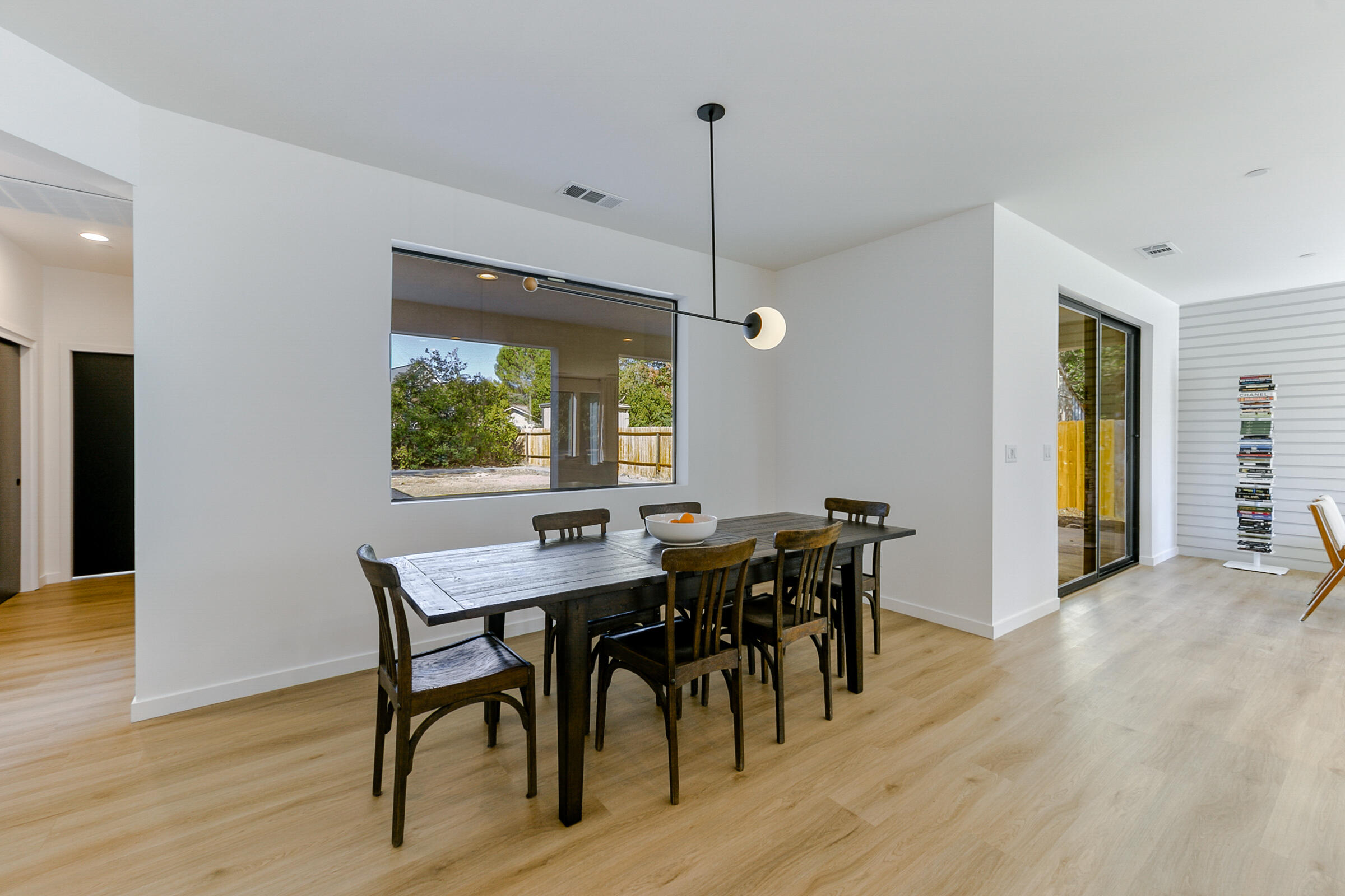 288 Tourmaline Way Redding, CA 96003 - Photo 9 of 46 a view of a dining room with furniture window and wooden floor
