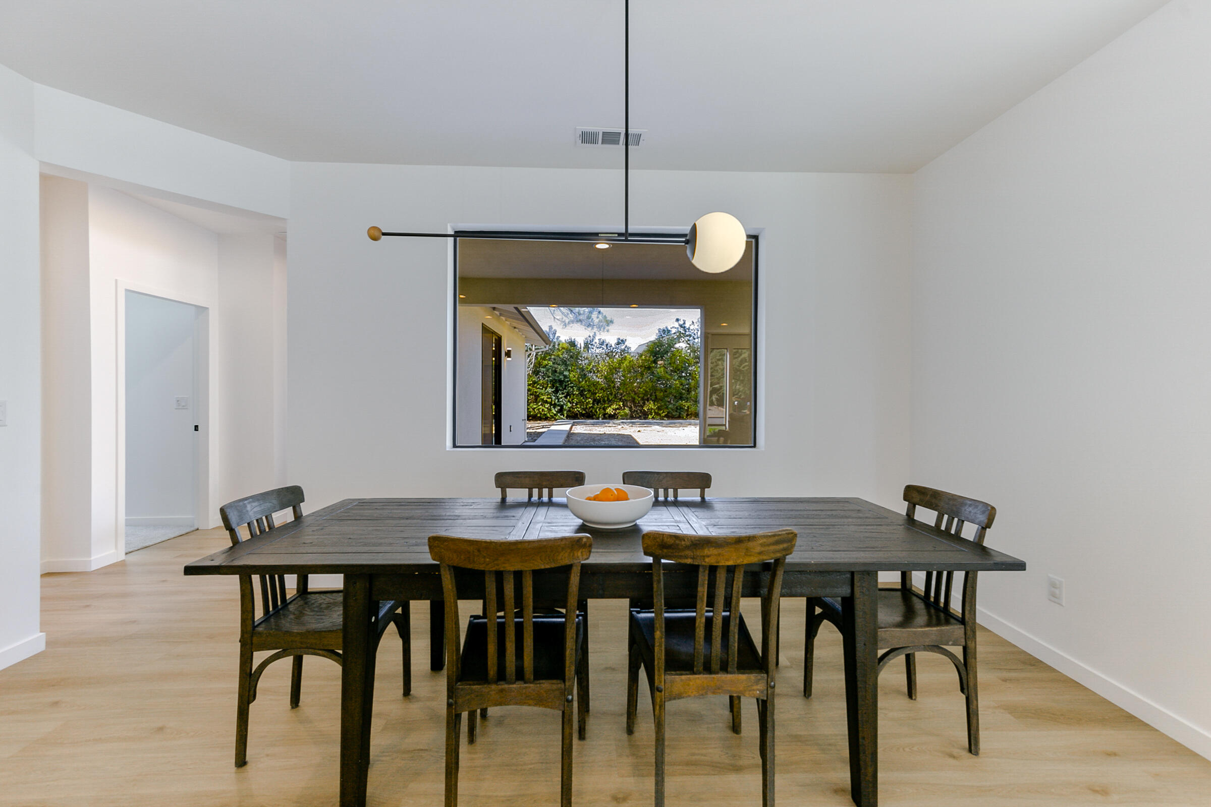 288 Tourmaline Way Redding, CA 96003 - Photo 10 of 46 a view of a dining room with furniture and wooden floor
