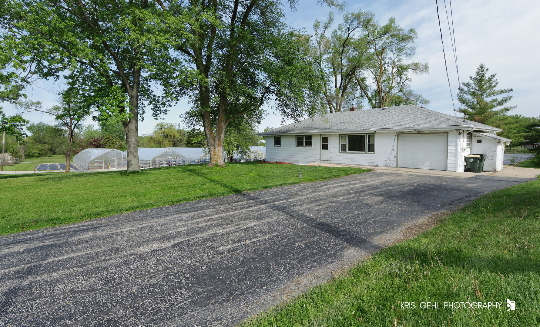 24260 Town Line Road Lake Villa, IL 60046 - Photo 2 of 20 a front view of a house with a yard and trees