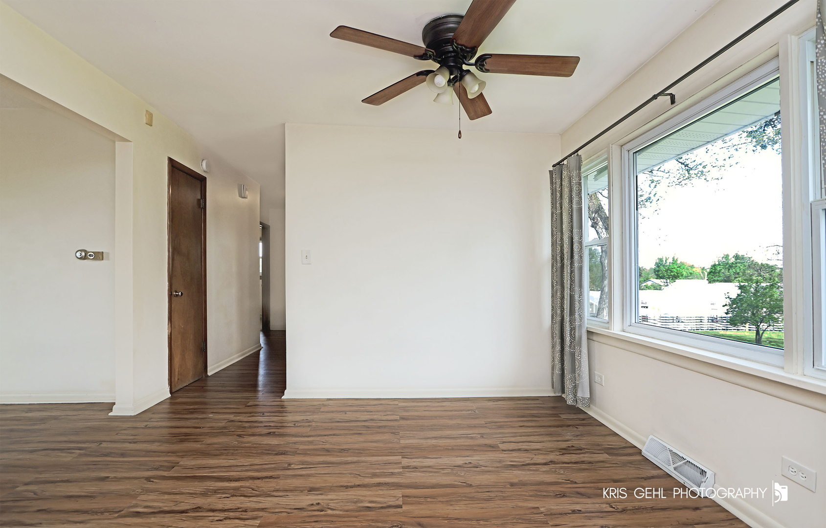 24260 Town Line Road Lake Villa, IL 60046 - Photo 9 of 20 a view of empty room with wooden floor and fan