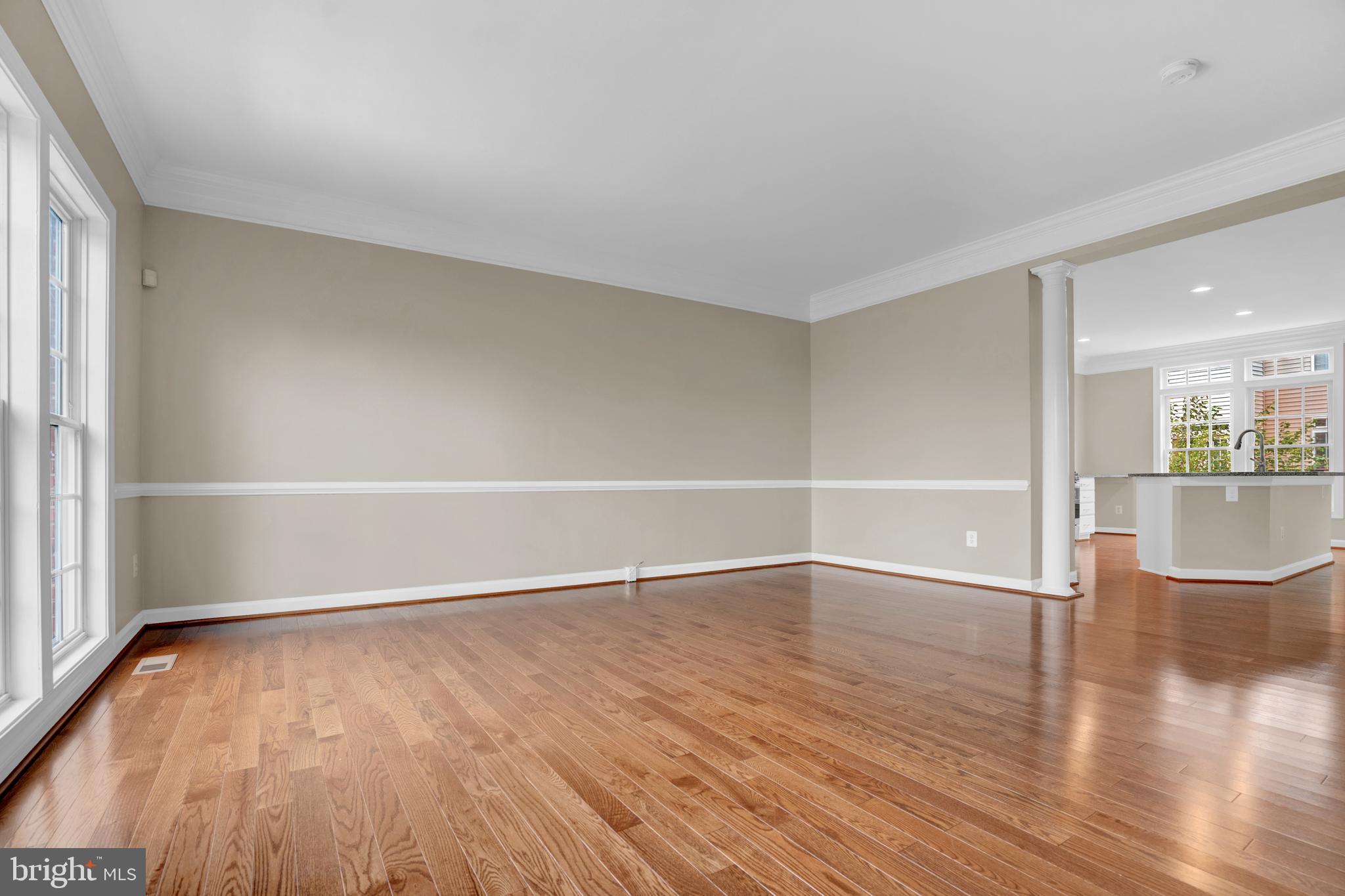 25548 Evans Square Chantilly, VA 20152 - Photo 3 of 36 a view of an empty room with wooden floor and a window