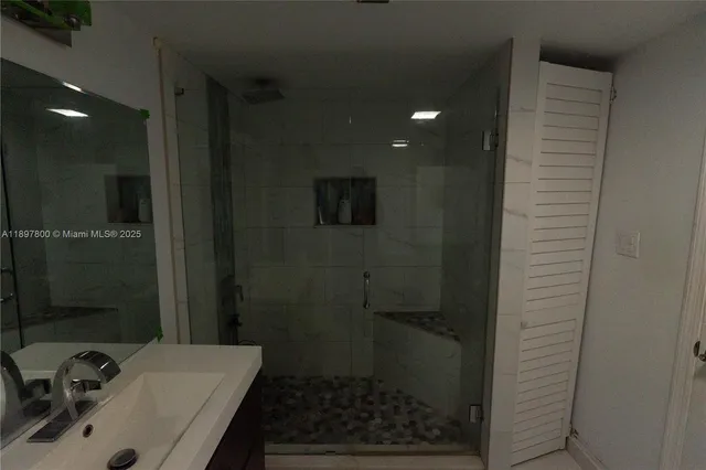 a view of a house with a yard and potted plants