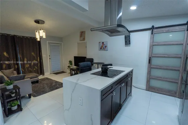 a kitchen with a stove and a refrigerator
