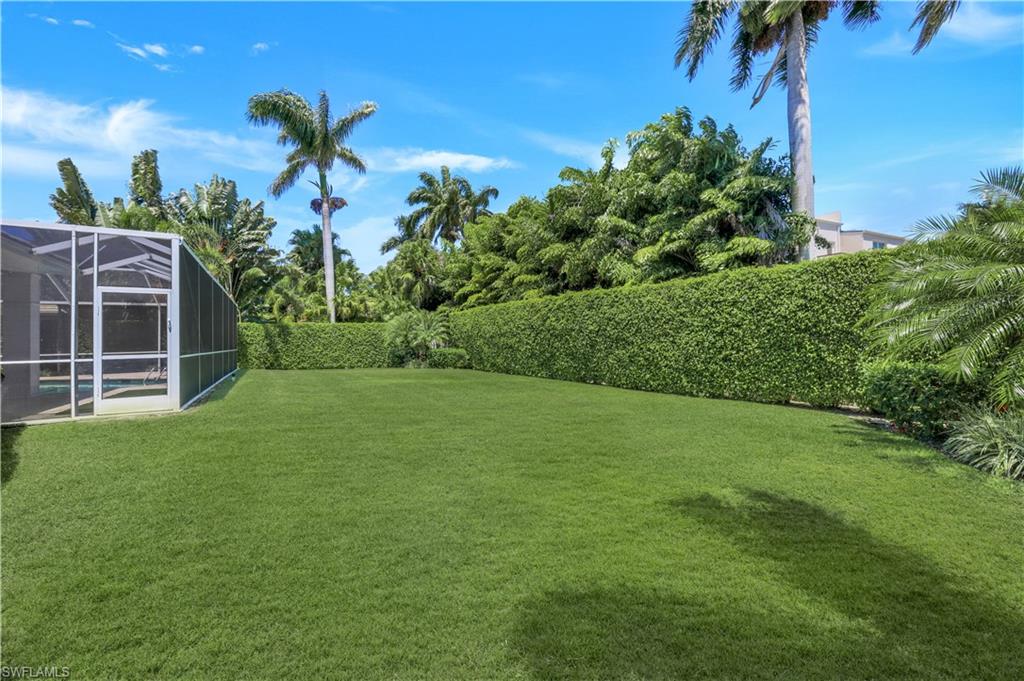 425 Rudder Road Naples, FL 34102 - Photo 30 of 31 a view of a house with a backyard