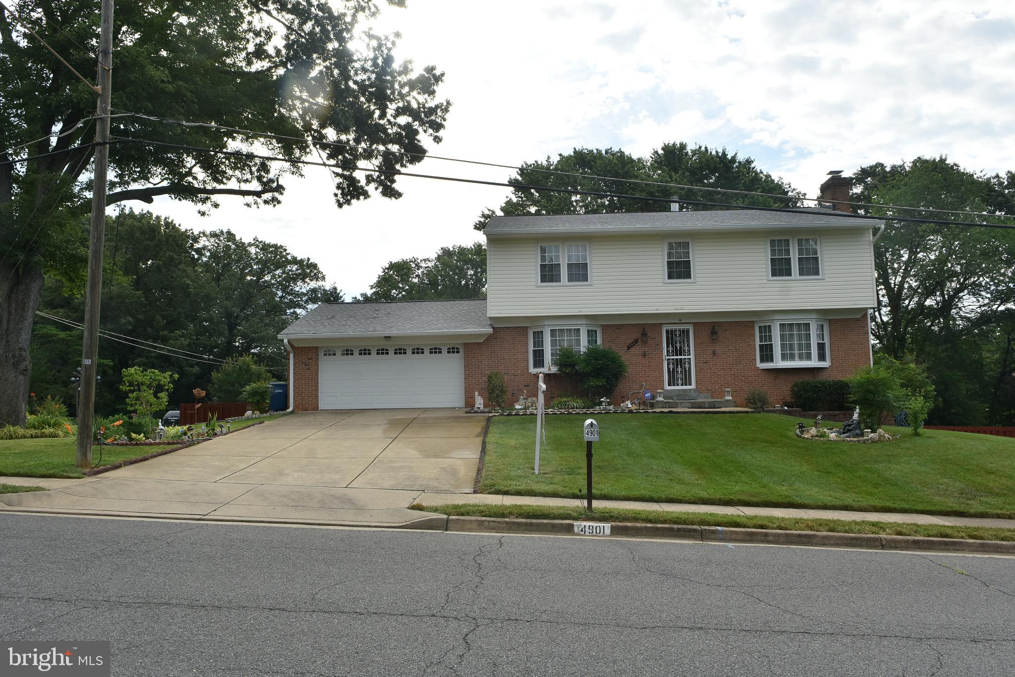 4901 Powell Road Fairfax, VA 22032 - Photo 1 of 64 Front view :2 car garage of 3 level colonial home