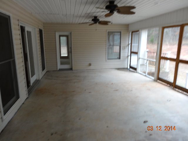 407 Genie Ethridge Road, Unit 1 Gray, GA 31032 - Photo 6 of 8 an empty room with windows