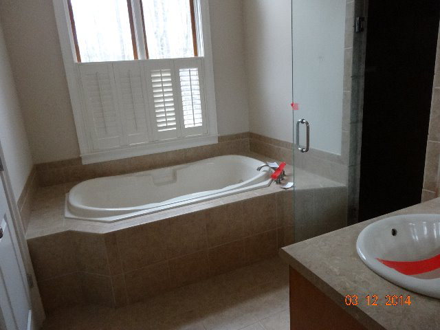 407 Genie Ethridge Road, Unit 1 Gray, GA 31032 - Photo 8 of 8 a bathroom with a bath tub and a sink