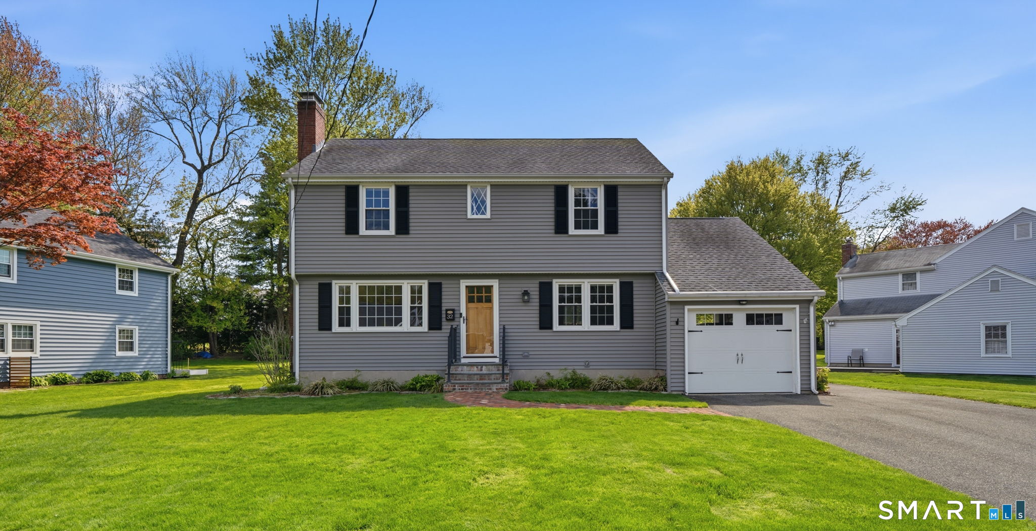 32 Meadowgate Street Wethersfield, CT 06109 - Photo 1 of 40 a front view of a house with a garden