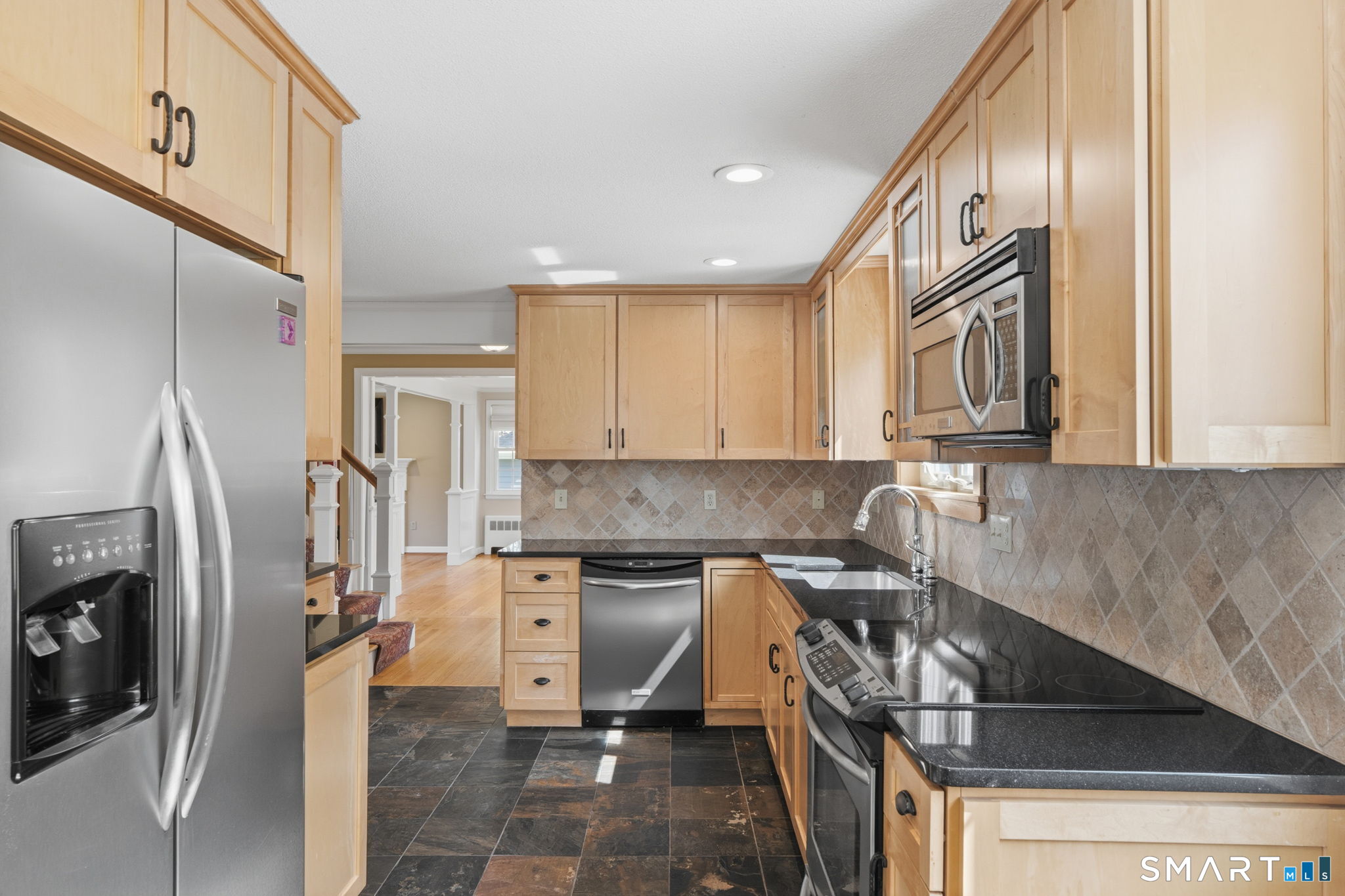 32 Meadowgate Street Wethersfield, CT 06109 - Photo 17 of 40 a kitchen with a sink appliances and cabinets