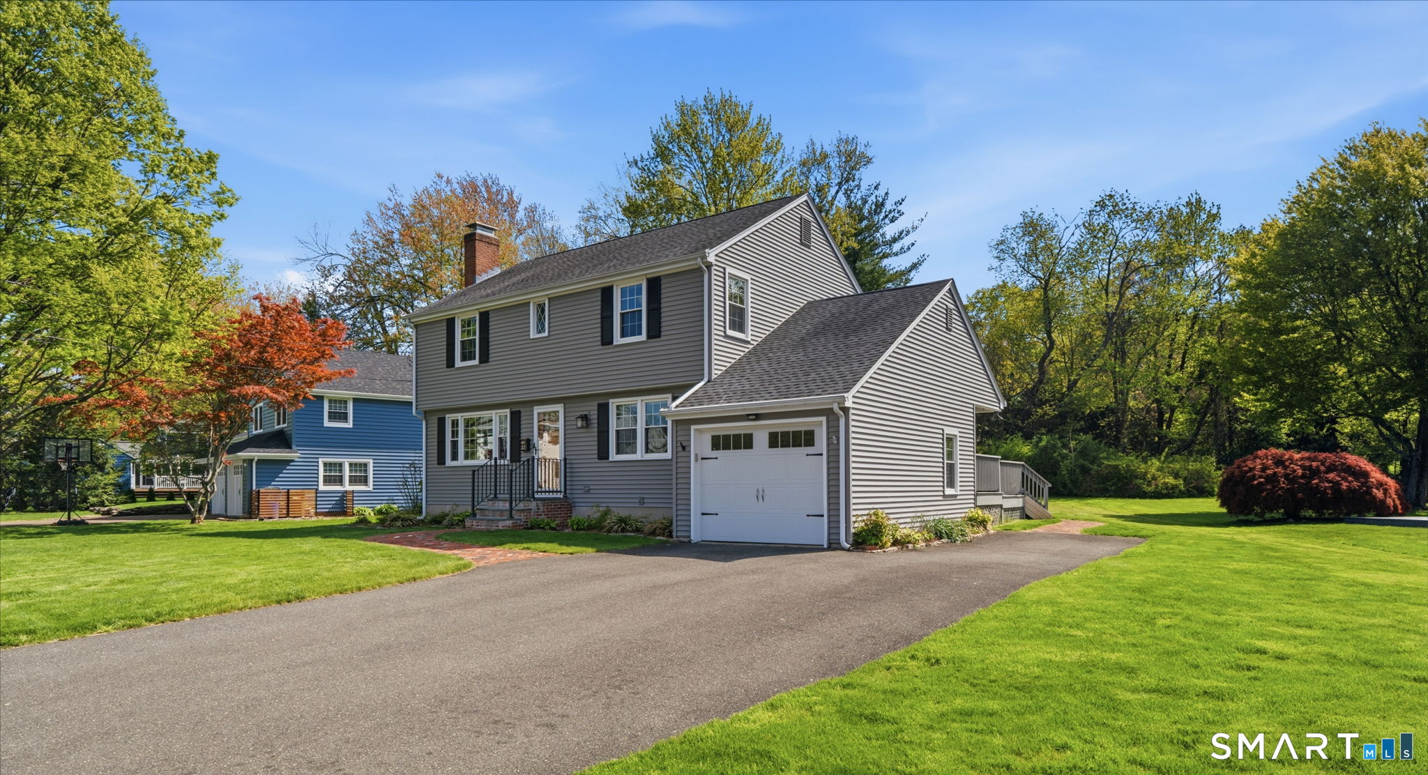 32 Meadowgate Street Wethersfield, CT 06109 - Photo 2 of 40 a front view of house with yard and green space