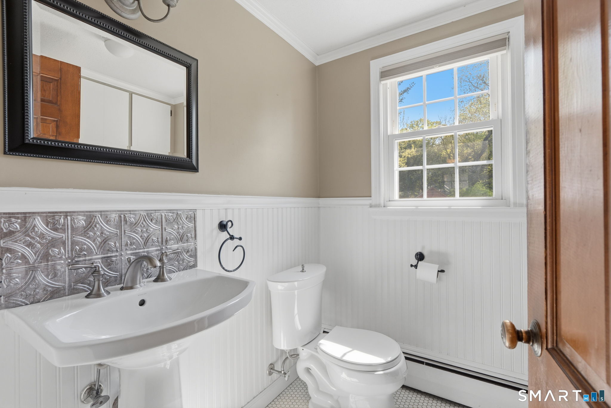 32 Meadowgate Street Wethersfield, CT 06109 - Photo 23 of 40 a bathroom with a toilet a sink and a mirror